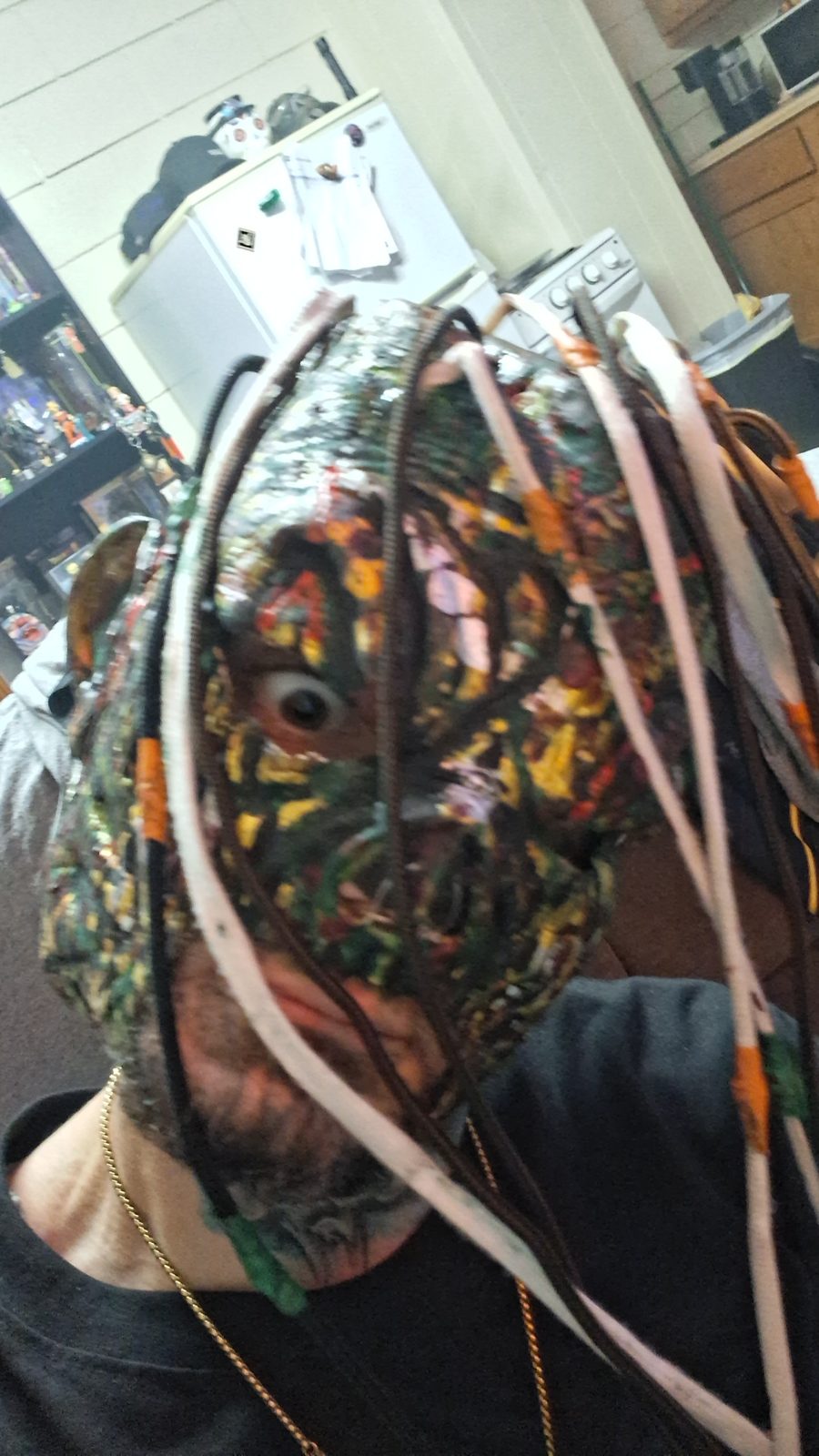 Photo of a hand-painted BoreScum mask with tubes