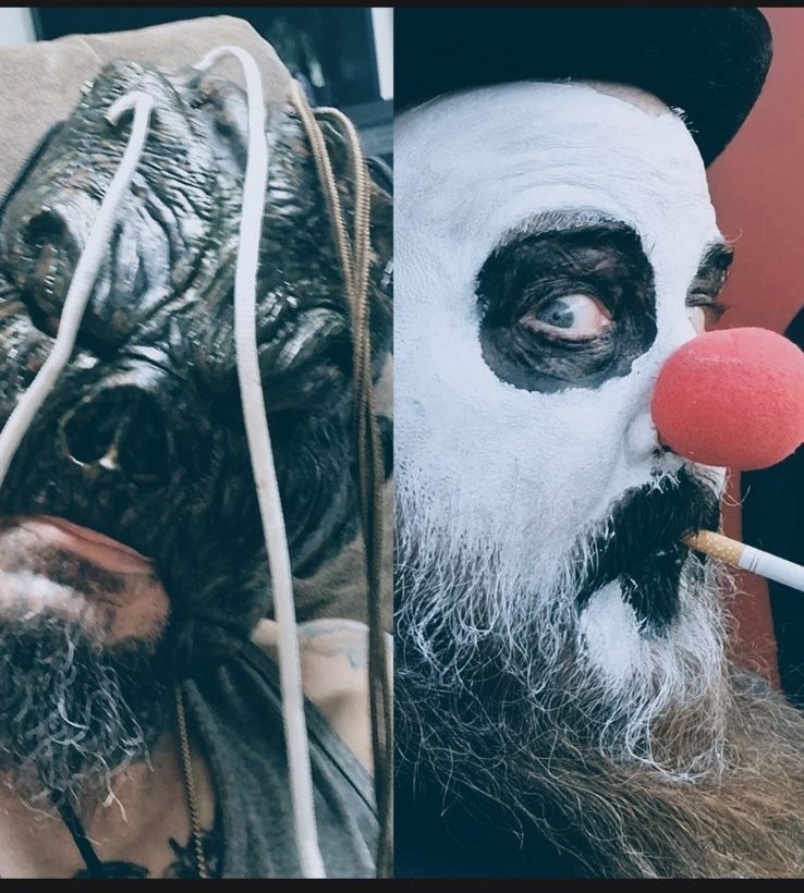 ToyBoxx in a dark creature mask beside Trainwreck in white clown face paint and a red nose